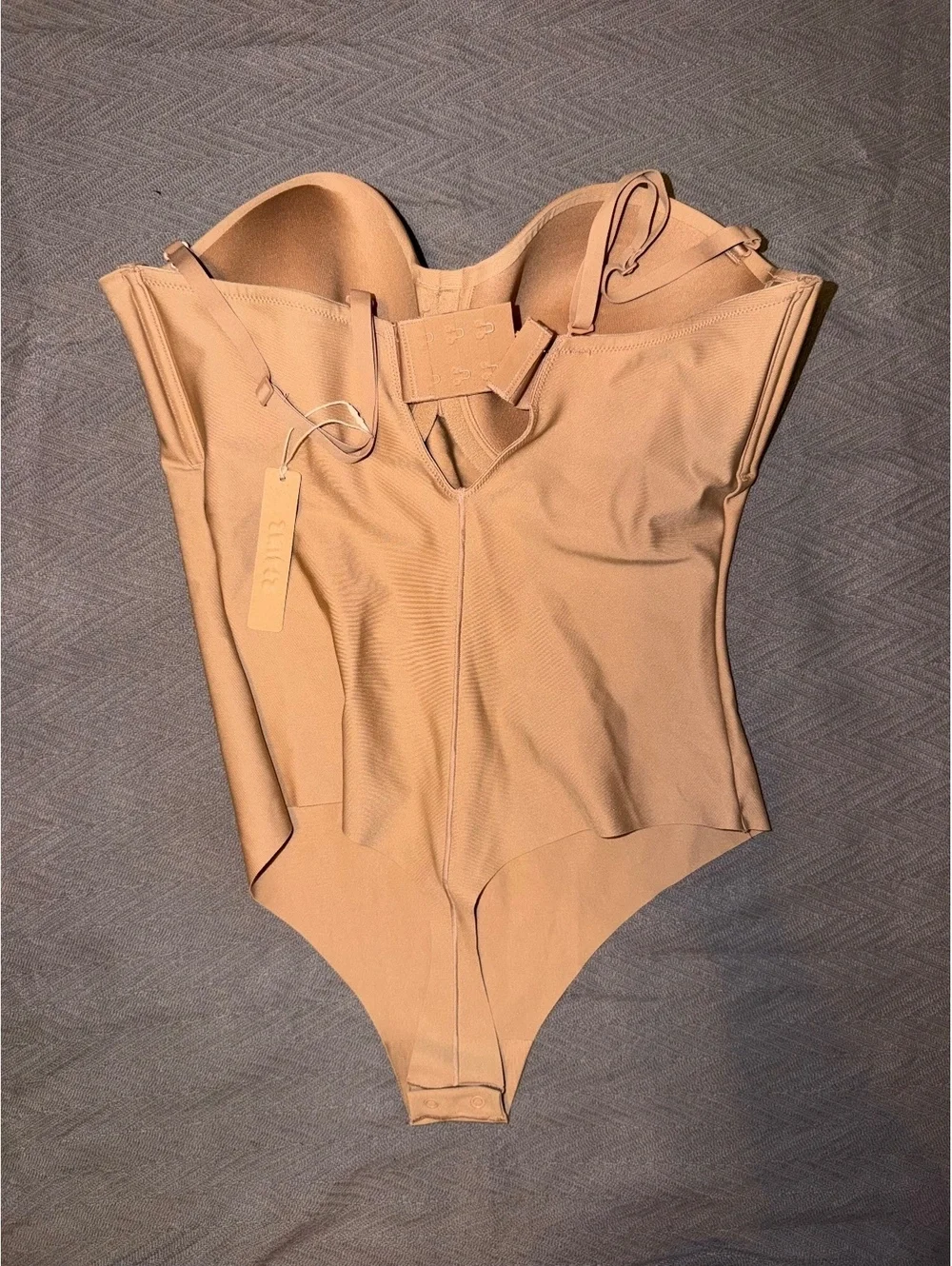 SKIMS Nude Shapewear Bodysuit with Adjustable Straps and Snap Closure